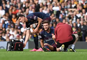 Fulham V Arsenal 2018-19 Prints: Arsenal's Mustafi and Xhaka: A Moment of Relief Amidst the Intensity of Fulham vs