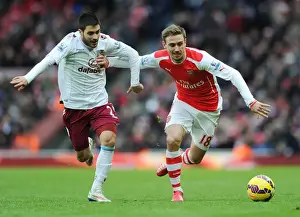 Arsenal V Aston Villa 2014-15 Prints: Arsenal's Nacho Monreal Holds Off Aston Villa's Carles Gil During Premier League Clash