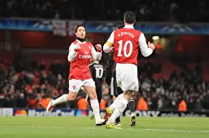 Arsenal's Nasri and van Persie Celebrate Third Goal Against Partizan Belgrade in the Champions League
