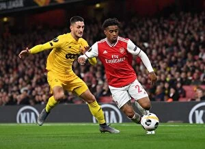 Arsenal v Standard Liege 2019-20 Collection: Arsenal's Nelson vs. Boljevic: A Europa League Battle at Emirates Stadium