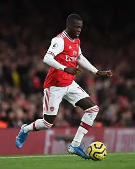 Arsenal V Brighton And Hove Albion 2019-20 Prints: Arsenal's Nicolas Pepe in Action: Premier League 2019-20 - Arsenal vs Brighton & Hove Albion
