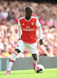Arsenal's Nicolas Pepe in Action: A Riveting Moment from the Arsenal vs. Burnley Match, 2019-20 Premier League