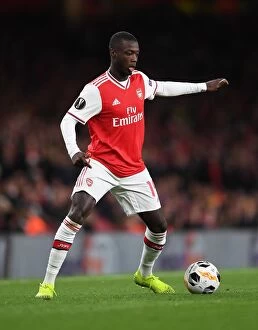 Arsenal v Standard Liege 2019-20 Collection: Arsenal's Nicolas Pepe in Action against Standard Liege in Europa League Group Stage
