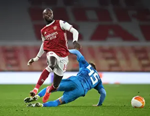 Arsenal's Nicolas Pepe Breaks Past Olympiacos Defender in Empty Emirates Stadium - Arsenal v Olympiacos, UEFA Europa League 2020-21