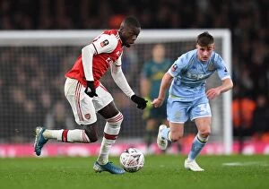 Images Dated 7th January 2020: Arsenal's Nicolas Pepe Clashes with Leeds United's Robbie Gotts in FA Cup Third Round