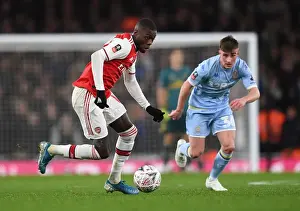 Arsenal V Leeds United FA Cup 2019-20 Prints: Arsenal's Nicolas Pepe Clashes with Leeds United's Robbie Gotts in FA Cup Third Round