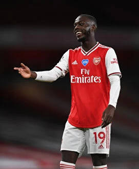 Images Dated 15th July 2020: Arsenal's Nicolas Pepe Faces Liverpool in Empty Emirates Stadium (Arsenal v Liverpool 2019-20)