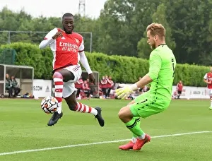 Arsenal's Nicolas Pepe Faces Off Against Millwall's George Long in Pre-Season Friendly