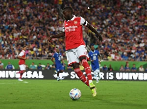 Images Dated 23rd July 2022: Arsenal's Nicolas Pepe Goes Head-to-Head Against Chelsea in the 2022-23 Florida Cup Pre-Season Clash