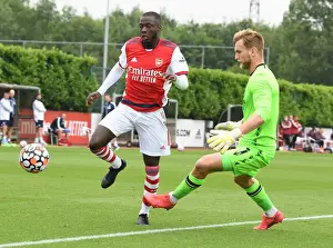Arsenal's Nicolas Pepe Goes Head-to-Head with Millwall's George Long in Pre-Season Clash