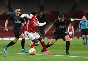 Arsenal's Nicolas Pepe Goes Head-to-Head with Slavia Praha in Empty Emirates Stadium - Europa League Quarterfinal