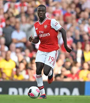 Arsenal's Nicolas Pepe Goes Head-to-Head with Tottenham in Premier League Battle