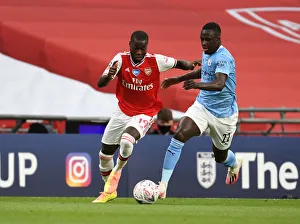 Arsenal's Nicolas Pepe Outmaneuvers Manchester City's Benjamin Mendy in FA Cup Semi-Final Showdown
