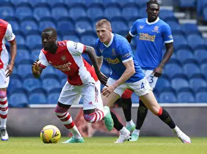 Arsenal's Nicolas Pepe Outmaneuvers Rangers John Lundstram in Pre-Season Clash