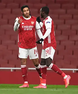 Arsenal's Nicolas Pepe and Pierre-Emerick Aubameyang Celebrate Goal in Empty Emirates Stadium during Arsenal v Slavia Prague UEFA Europa League Quarterfinal