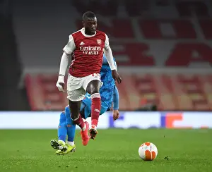 Arsenal V Olympiacos 2020-21 Prints: Arsenal's Nicolas Pepe in UEFA Europa League Action against Olympiacos (Behind Closed Doors)