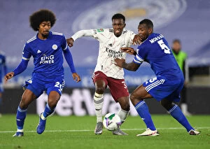 Leicester City v Arsenal Carabao Cup 2020-21 Collection: Arsenal's Nketiah Clashes with Leicester's Choudhury and Morgan in Carabao Cup Showdown
