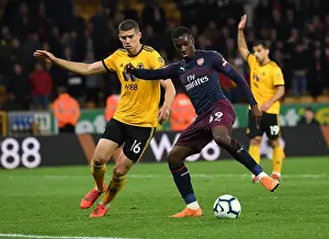 Wolverhampton Wanderers V Arsenal 2018-19 Prints: Arsenal's Nketiah Faces Off Against Wolverhampton's Coady in Premier League Clash
