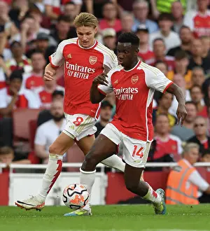 Arsenal's Nketiah and Odegaard Face Off Against Manchester City in 2023-24 Premier League