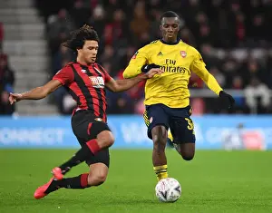 AFC Bournemouth V Arsenal - FA Cup 4th Rd 2020 Prints: Arsenal's Nketiah vs. Ake: A FA Cup Battle at Bournemouth