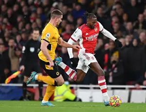 Arsenal's Nuno Tavares Clashes with Leander Dendoncker of Wolverhampton Wanderers: A Premier League Showdown