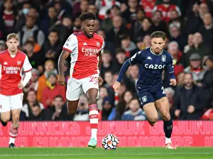 Arsenal's Nuno Tavares Outmaneuvers Aston Villa's Matty Cash in Premier League Clash