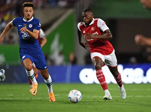 Images Dated 23rd July 2022: Arsenal's Nuno Tavares Outmaneuvers Chelsea's Ethan Ampadu in Florida Cup Clash
