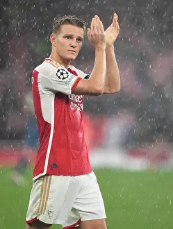 Arsenal's Odegaard Applauds Fans After Arsenal v PSV Eindhoven UEFA Champions League Victory, 2023-24