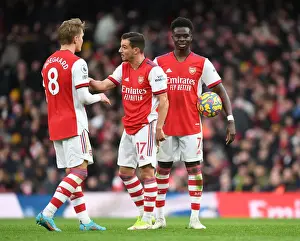 Arsenal's Odegaard, Cedric, and Saka in Action against Brentford (2021-22)