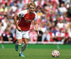 Arsenal's Odegaard Dashes Through Emirates: Arsenal vs. Nottingham Forest (2023-24)