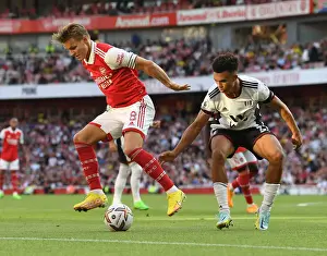 Arsenal's Odegaard Faces Off Against Fulham's Robinson in Premier League Clash