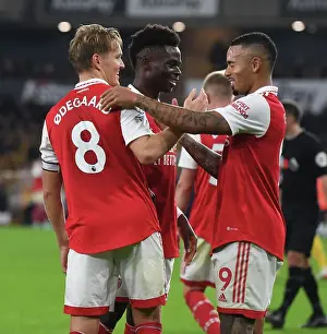 Arsenal's Odegaard and Saka: Celebrating Goals in Style against Wolverhampton Wanderers (2022-23)