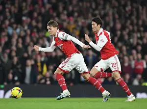 Arsenal V Manchester City 2022-23 Prints: Arsenal's Odegaard and Tomiyasu in Action against Manchester City