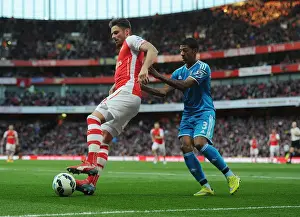 Arsenal's Olivier Giroud Battles Past Sunderland's Patrick van Aanholt in Intense Premier League Showdown