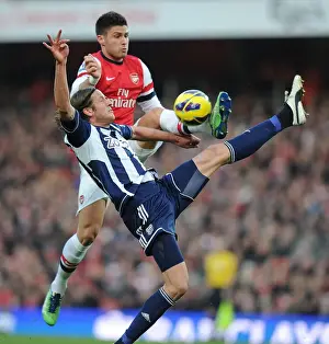 Arsenal V West Bromwich Albion 2012-13 Prints: Arsenal's Olivier Giroud Clashes with West Brom's Jonas Olsson in Premier League Showdown