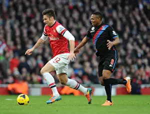 Arsenal's Olivier Giroud Faces Off Against Crystal Palace's Kagisho Dikgacoi in Premier League Clash