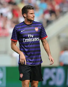 Arsenal's Olivier Giroud Faces Off Against FC Cologne in 2012 Pre-Season Friendly