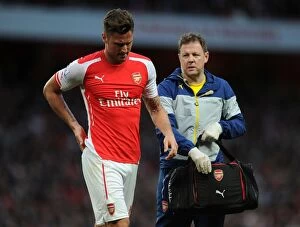 Images Dated 11th May 2015: Arsenal's Olivier Giroud Receives Attention from Physio Colin Lewin during Swansea City Match