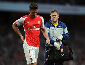 Arsenal Swansea City 2014/15 Prints: Arsenal's Olivier Giroud Receives Attention from Physio Colin Lewin during Swansea City Match