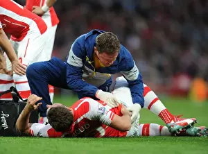 Arsenal Swansea City 2014/15 Prints: Arsenal's Olivier Giroud Receives Medical Attention from Physio Colin Lewin during Swansea City Match (2015)