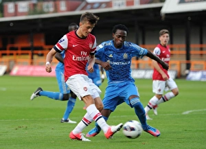 Arsenal U19 V Olympique De Marseille - NextGen 2012-13 Prints: Arsenal's Olsson Faces Off Against Marseille's Charles in NextGen Series Clash