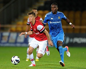 Arsenal U19 V Olympique De Marseille - NextGen 2012-13 Prints: Arsenal's Olsson Outpaces Marseille's Anani in NextGen Series Clash