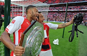 Arsenal V Manchester City - FA Community Shield 2014/15 Prints: Arsenal's Oxlade-Chamberlain and Cazorla: A Pre-Season Rivalry - Arsenal vs Manchester City