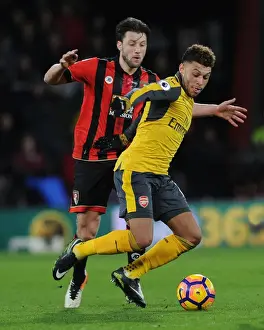 AFC Bournemouth V Arsenal 2016-17 Prints: Arsenal's Oxlade-Chamberlain Clashes with Bournemouth's Arter in Premier League Showdown