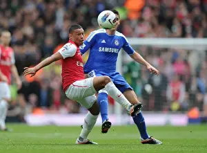 Arsenal V Chelsea 2011-12 Prints: Arsenal's Oxlade-Chamberlain Clashes with Chelsea's Romeu: A Premier League Showdown at Emirates Stadium