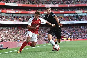 Arsenal V Seville - Emirates Cup 2017-18 Prints: Arsenal's Oxlade-Chamberlain Clashes with Sevilla's Corchia in Emirates Cup Battle
