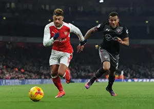 Arsenal V Southampton EFL Cup 2016-17 Prints: Arsenal's Oxlade-Chamberlain Clashes with Southampton's Bertrand in EFL Cup Quarter-Final