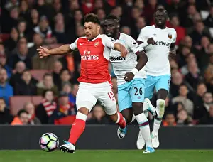 Arsenal V West Ham United 2016-17 Prints: Arsenal's Oxlade-Chamberlain Clashes with West Ham's Masuaku in Premier League Showdown