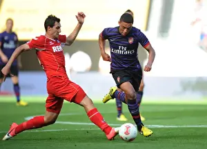 Arsenal's Oxlade-Chamberlain Faces Off Against Cologne's Jajalo in 2012 Pre-Season Clash