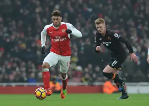 Arsenal V Hull City 2016-17 Prints: Arsenal's Oxlade-Chamberlain Faces Off Against Hull's Clucas in Premier League Clash
